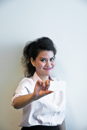 Business woman show white blank card on white backgroudの写真素材