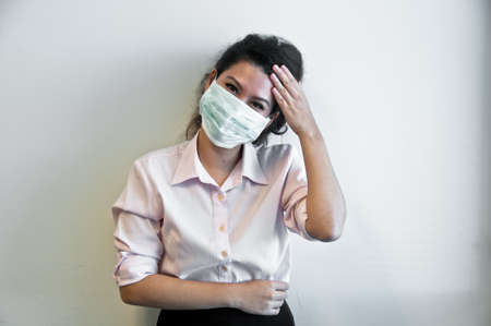 Business woman wear hygiene mask and sickの写真素材