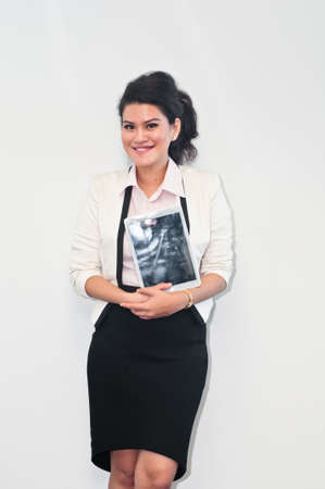 Business woman stand and hold tabletの写真素材