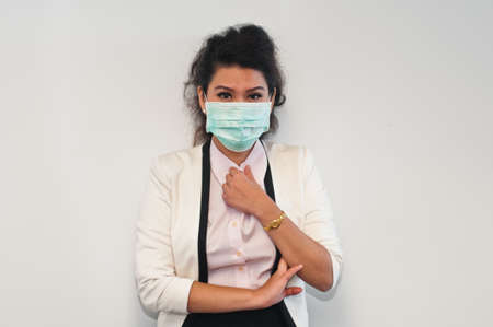 Business woman caught and wear mask coverの写真素材