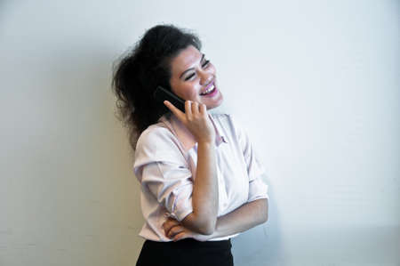 Business woman make a call on white backgroundの写真素材