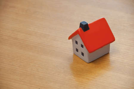 House toy model on brown wooden tableの写真素材