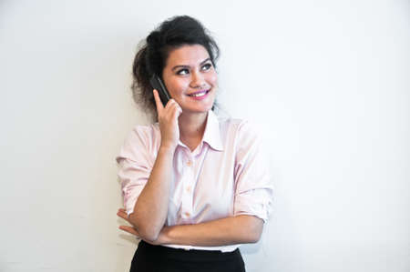 Business woman make a call on white backgroundの写真素材