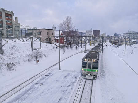 Snow railtrack and train in Otoru city Hokkaido Japan mid Winterのeditorial素材