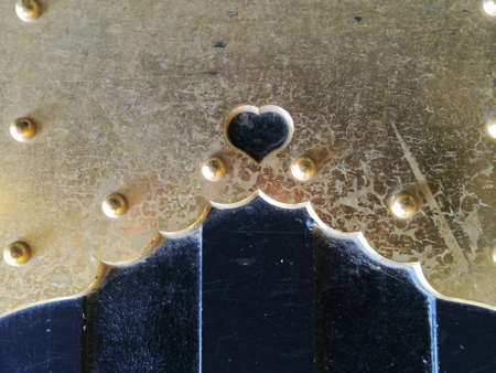 Heart shape golden colour wall backgroundの写真素材