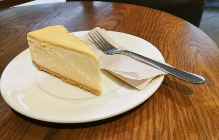 Yummy New York Cheese cake with silver spoon