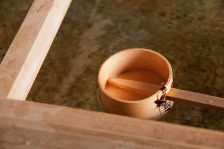 Wooden dipper of holy zen water in Japan Shinto templeの写真素材
