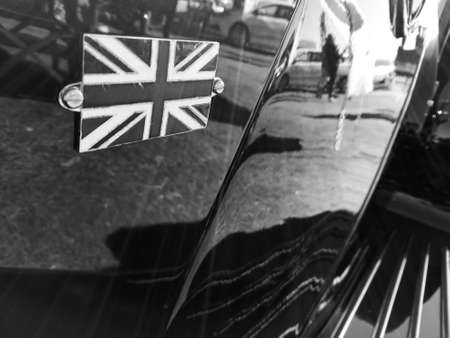 United Kingdom National Union Jack on classical car in black and whiteの写真素材