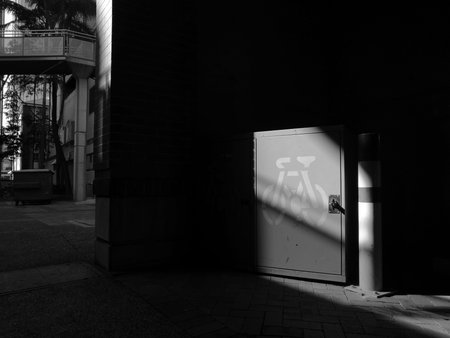 Light focus at bicycle storage shade in building in black and whiteの写真素材