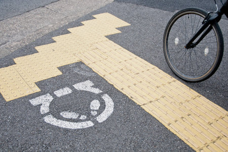 Bicycle waiting line for a person in Tokyo. The text means to stop
