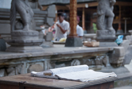 Guest book on wooden table in Bali Hindu templeの写真素材