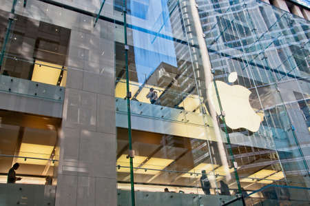 SYDNEY, AUSTRALIA - MAY 5, 2018: Apple store with a big white apple logo on a glass wall in Sydney city center. Apple is a multi national corporation technology company from the USA.のeditorial素材