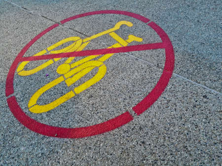 Sign of no bicycle is allowed marked on a roadの写真素材