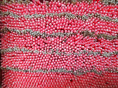 Chinese aroma incense red sticks in a templeの写真素材