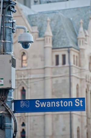 MELBOURNE, AUSTRALIA - JULY 29, 2018: Surveillance CCTV street outdoor camera watching pedestrian near St Paul's cathedral church in city center to prevent terrorism. The photo is taken in the afternoon.のeditorial素材