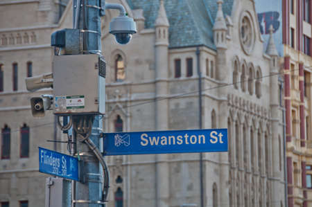 MELBOURNE, AUSTRALIA - JULY 29, 2018: Surveillance CCTV street outdoor camera watching pedestrian near St Paul's cathedral church in city center to prevent terrorism. The photo is taken in the afternoon.のeditorial素材