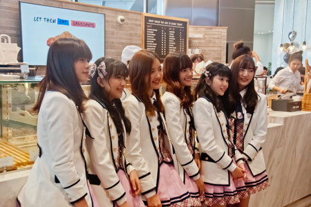 BANGKOK, THAILAND - NOVEMBER 23, 2018: A group members of Thai Idol girl group BNK48, smiles at the ...