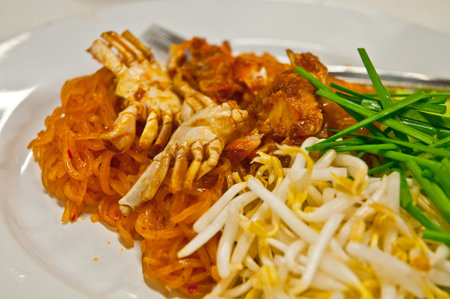 Small crabs deep fried with Thai pad-thai noodle stir-fried sweet & sour sauce with bean sproutsの写真素材