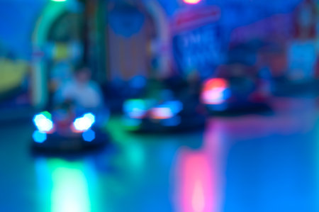 Abstract random colourful defocused blurred go-kart cars of fun fair background patternの写真素材