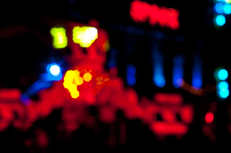 Abstract random colourful defocused blurred night life of fun fair background patternの写真素材