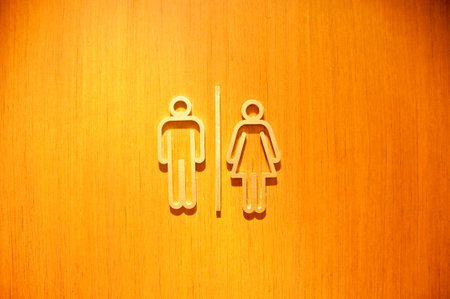 Man and woman sign symbols of toilet wooden doorin a pubの写真素材