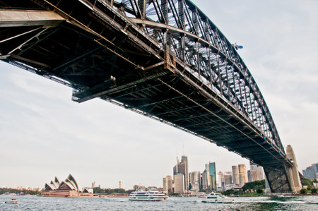 SYDNEY, AUSTRALIA - APRIL 13, 2019: Sydney Harbour Bridge with Opera House far away in Sydney Harbour Australiaのeditorial素材