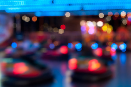 Abstract random colourful defocused blurred go-kart cars of fun fair background patternの写真素材
