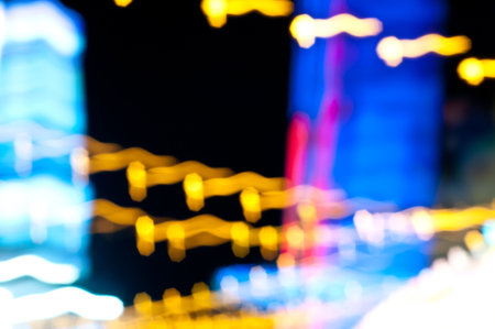 Abstract random colourful defocused blurred background pattern night life of local marketの写真素材