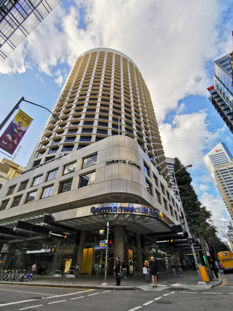 BRISBANE, AUSTRALIA - MAY 19, 2020: Commonwealth Bank of Australia (CBA) flagship headquarters office high-rise building in Brisbane Central Business District on Queen Street. There are people waiting at intersection.のeditorial素材