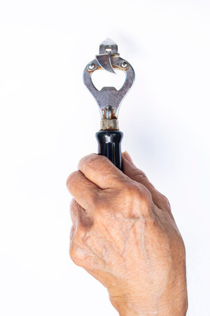 Senior woman's right hand holding bottle opener isolated on white background