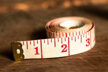 Tape measure on wood texture background, Close up & Macro shot, Selective focus