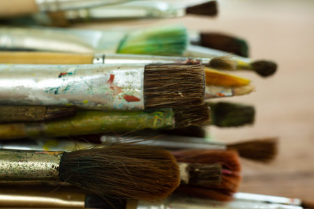 Old, Dirty Paint Brushes on wood table ground, Close up & Macro shot, Selective focus, Stationery...