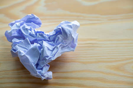 Crumpled white paper on wood table, Shape " Heart " Close up & Macro shot, Selective focus, Brainstorming, Creative idea, Business conceptの写真素材