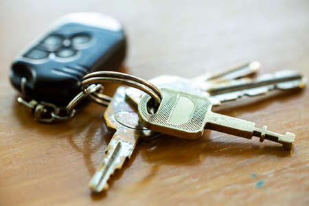 Keys with remote on wooden texure, background, Close up & Macro shot, Selective focusの写真素材