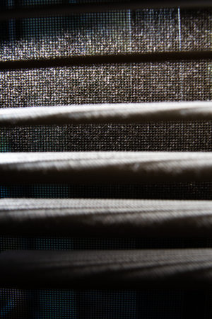 Dust and Dirty mosquito wire screen window, Dust blinds inside a window, Light & Shadow shot, Close...