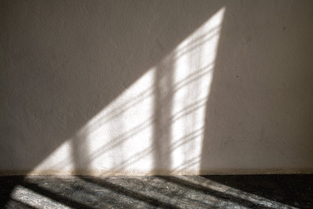 Light through curtain to white coloured Cement wall and Grey coloured concrete floor, Textures...
