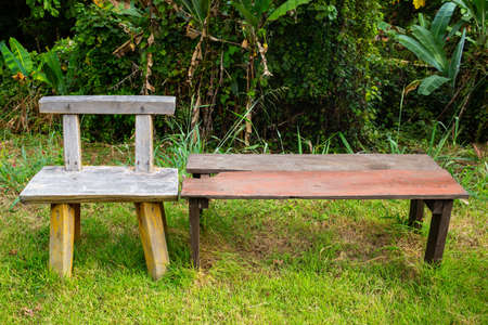 Handmade wooden chair on the grass texture backgroundの写真素材