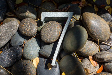 Number 7 (seven) made  from  galvanized iron on pebble