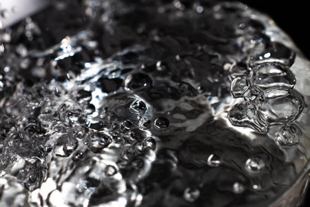 Clear water bubbles floating in transparent glass, Close up & Macro shot, Selective focus, Healthy...