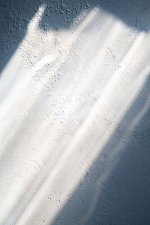 Abstract rough concrete texture background, White painted colour, Close up & Macro shot, Light & Shadow, Interior home conceptの写真素材
