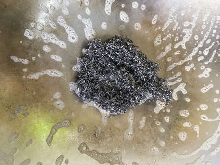 Steel wool for washing on flying panの写真素材