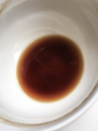Quarter full of black coffee, White cup of coffee on wooden table background, Close up shot
