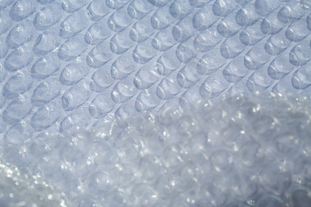 Plastic Bubble Cushioning Wrap surface texture on white background, Light & Shadow concept