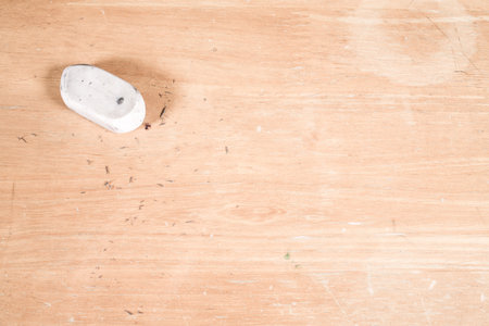 Eraser on wooden background, Close up