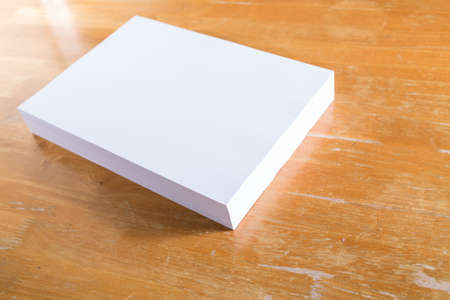 White paper on wood tableの写真素材