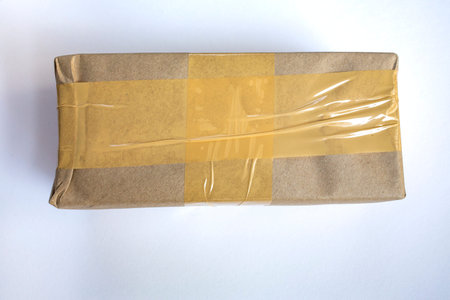 Cardboard box with Sticky tape  isolated on white backgroundの写真素材