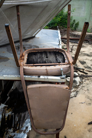 Abandoned broken leatherette chairの写真素材