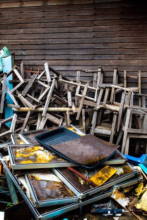 Broken vintage wooden chairs with rusty metal in old schoolの写真素材