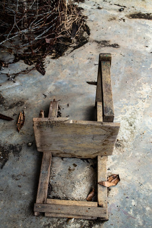 Abandoned broken vintage wooden chair in old schoolの写真素材