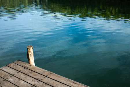 Wooden pier over the riverの写真素材